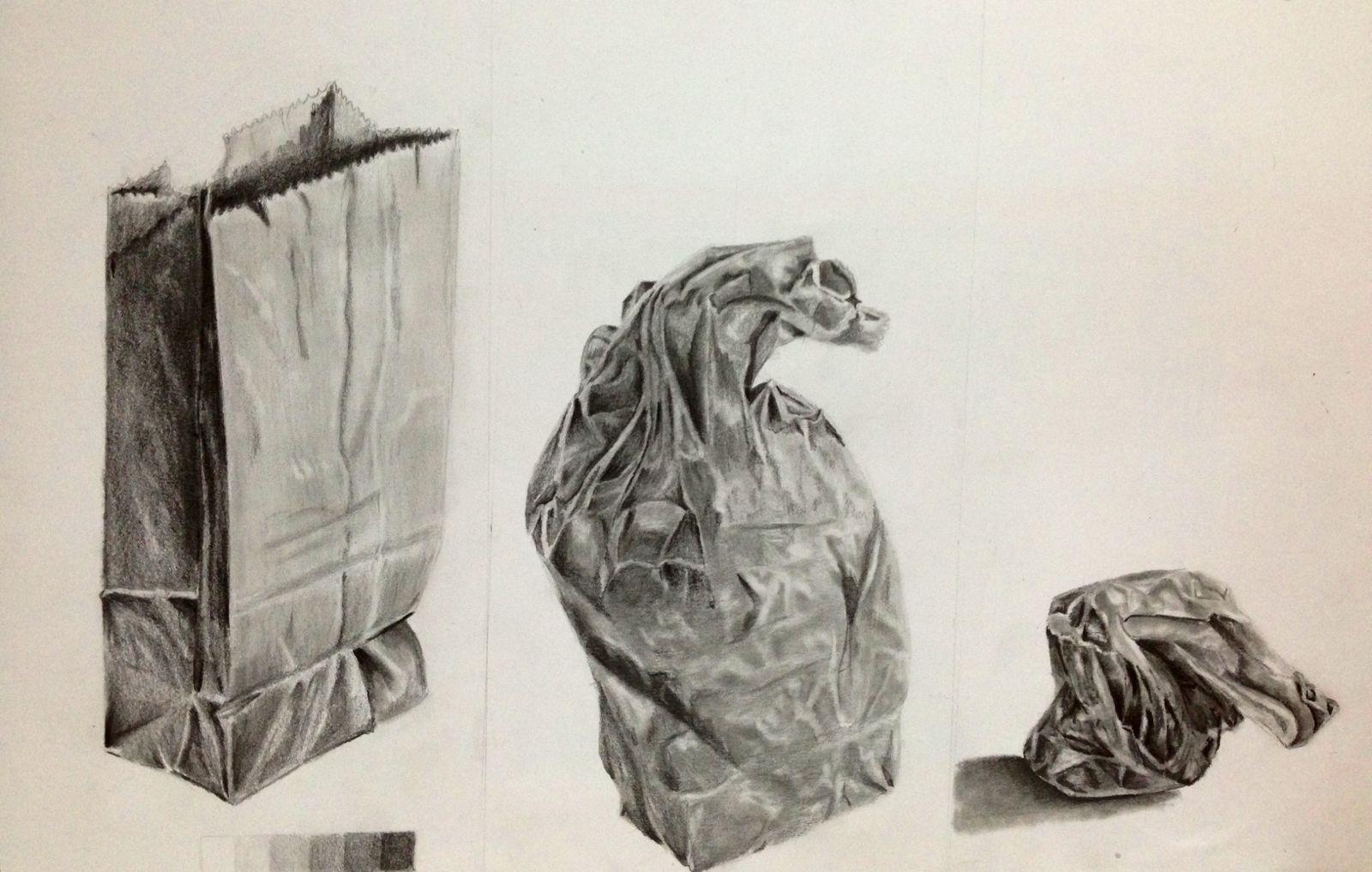 Value exercise with graphite pencil using a paper bag and eraser
